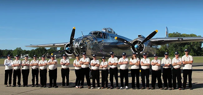 MIA Hunters team members with a B-25